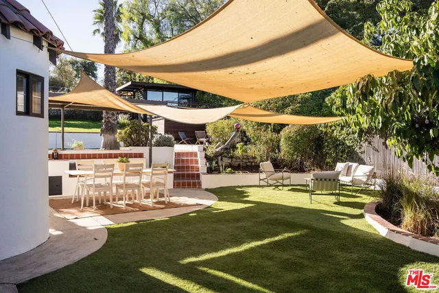 an aerial view of a house with swimming pool
