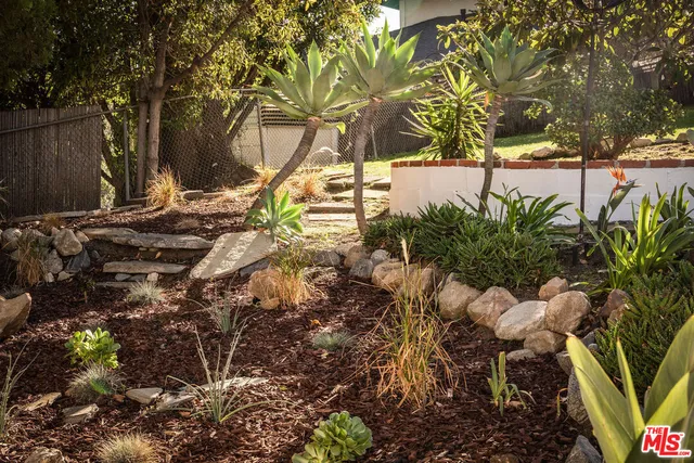 a view of a yard from a balcony