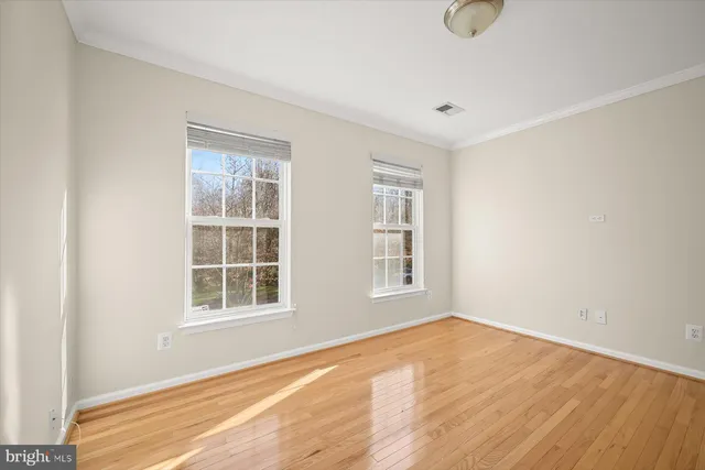 a spacious bathroom with a tub sink and mirror