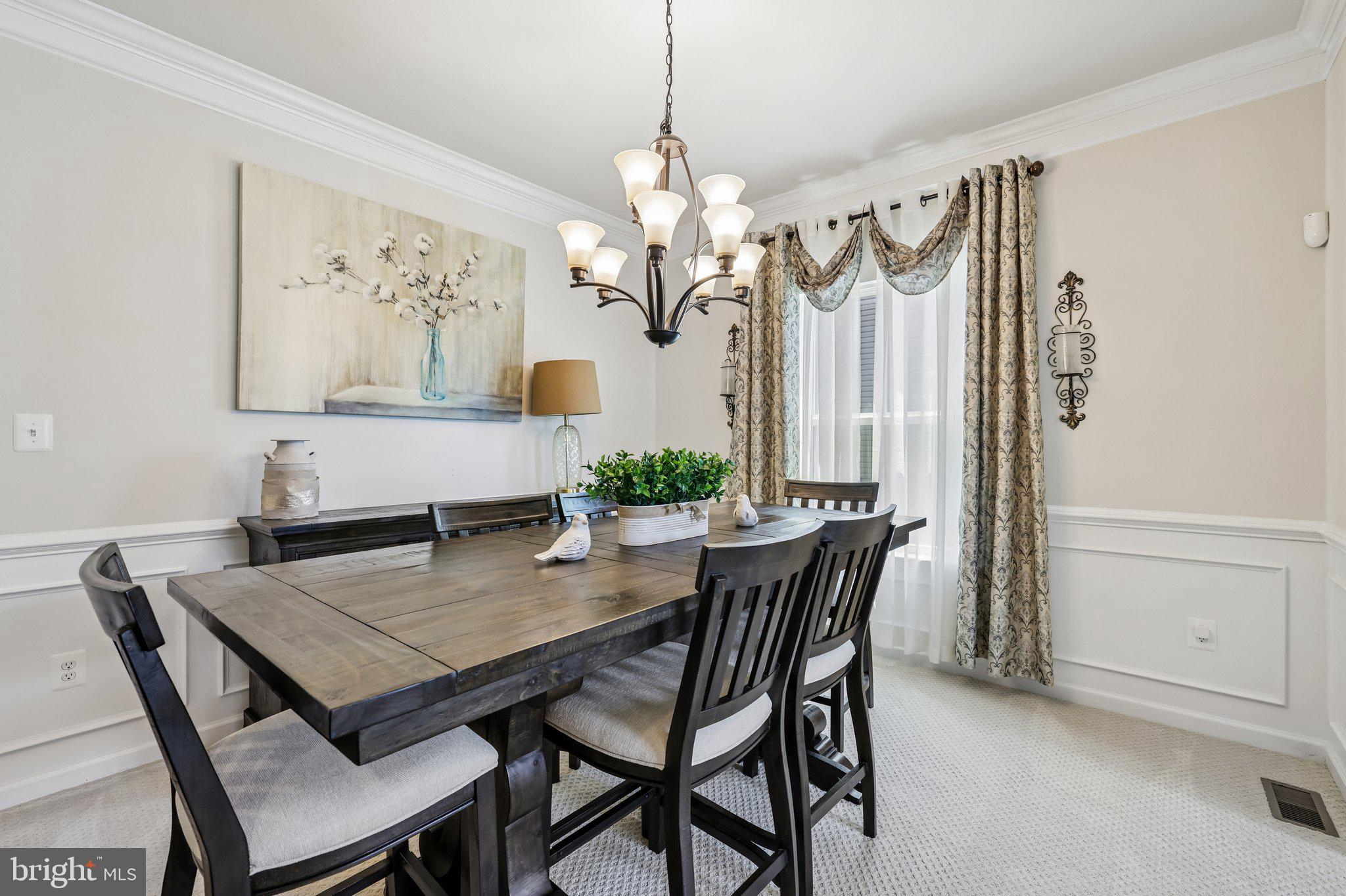 507 Potomac Road Joppa, MD 21085 - Photo 22 of 66 a view of a dining room with furniture window and wooden floor