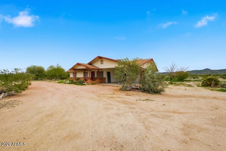19402 West Lynx Road Buckeye, AZ 85326 - Photo 1 of 42 a front view of a house with a yard