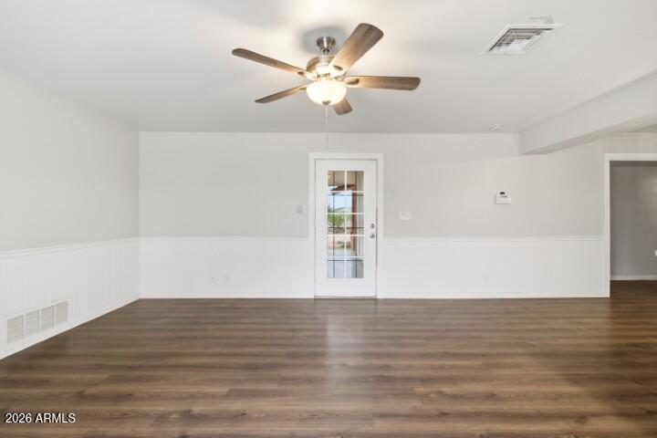 19402 West Lynx Road Buckeye, AZ 85326 - Photo 12 of 42 a view of an empty room with wooden floor