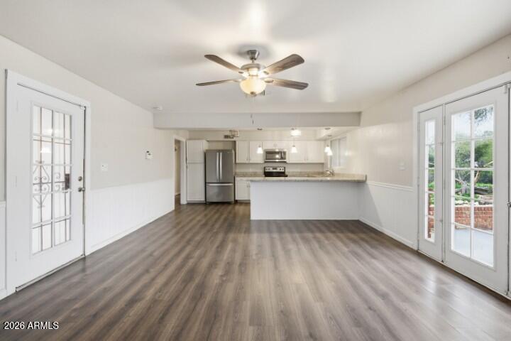 19402 West Lynx Road Buckeye, AZ 85326 - Photo 13 of 42 a view of a kitchen with wooden floor and a kitchen