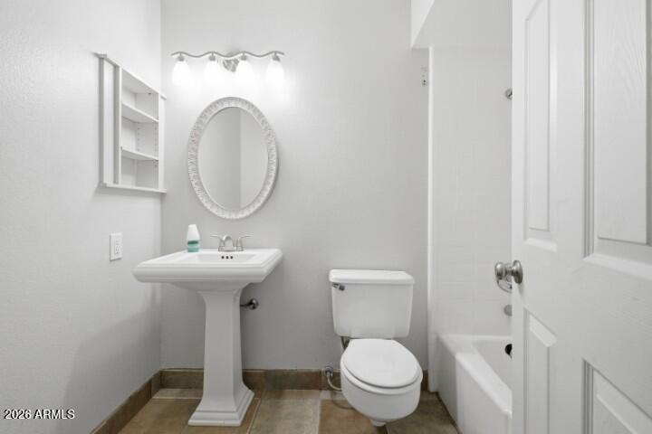 19402 West Lynx Road Buckeye, AZ 85326 - Photo 19 of 42 a bathroom with a sink and a mirror
