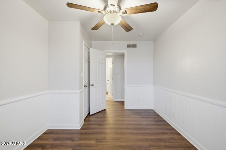 19402 West Lynx Road Buckeye, AZ 85326 - Photo 22 of 42 a view of a chandelier fan and wooden floor