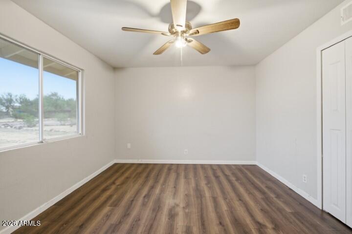 19402 West Lynx Road Buckeye, AZ 85326 - Photo 24 of 42 an empty room with a window and a ceiling fan