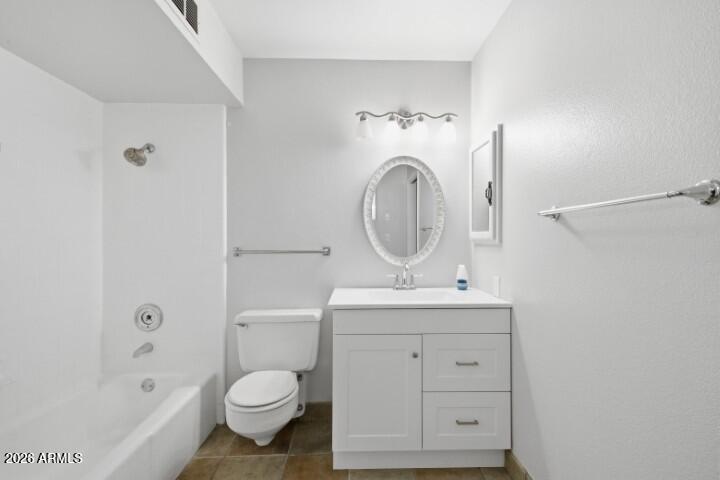 19402 West Lynx Road Buckeye, AZ 85326 - Photo 29 of 42 a bathroom with a sink toilet and shower