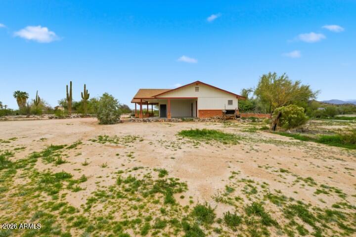 19402 West Lynx Road Buckeye, AZ 85326 - Photo 30 of 42 a view of a dirt road and a building