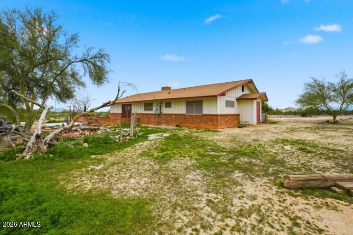 19402 West Lynx Road Buckeye, AZ 85326 - Photo 33 of 42 a view of a house with a yard