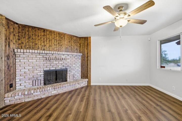 19402 West Lynx Road Buckeye, AZ 85326 - Photo 6 of 42 a view of empty room with wooden floor and fan