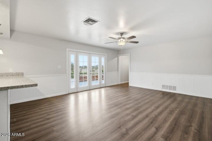 19402 West Lynx Road Buckeye, AZ 85326 - Photo 10 of 42 wooden floor in an empty room with a window