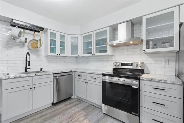 a bedroom with a bed and a ceiling fan