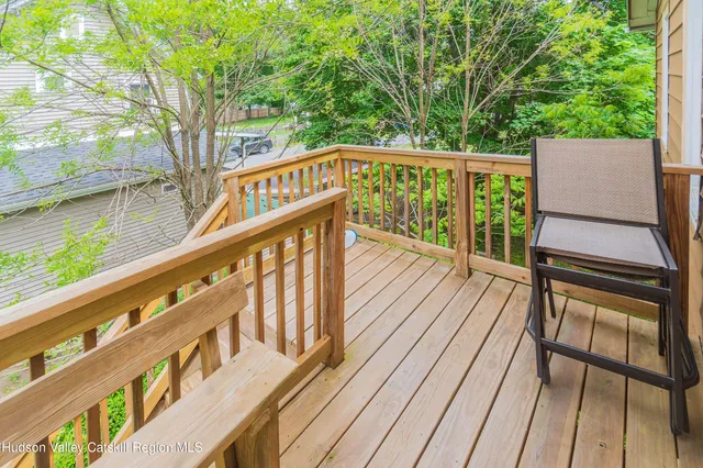a view of deck with wooden floor and outdoor seating