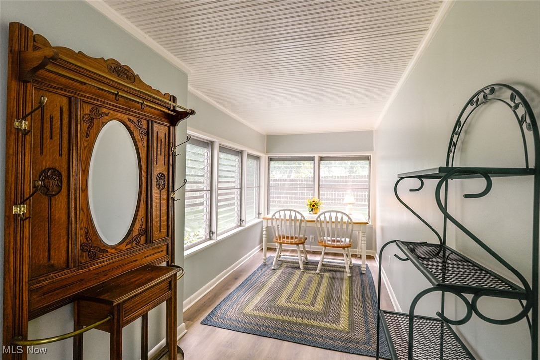 2488 Holgate Road Akron, OH 44313 - Photo 29 of 50 Recently updated breezeway with luxury vinyl flooring, great craft/study/office space!