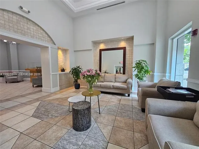 a view of a swimming pool with outdoor seating and a buildings view