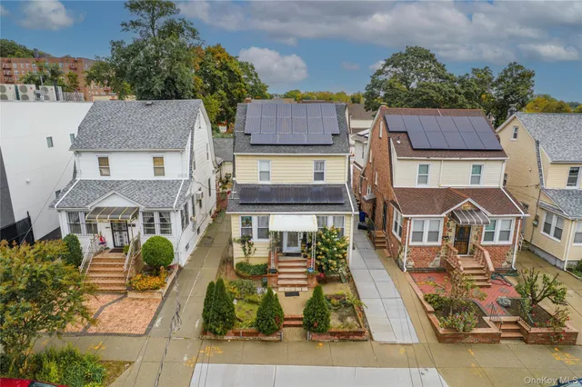 an aerial view of a residential apartment building with a yard