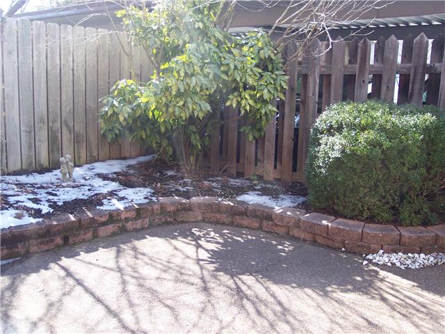 4001 Anderson Road, Unit D74 Nashville, TN 37217 - Photo 11 of 17 Beautiful patio with flowers and shrubs