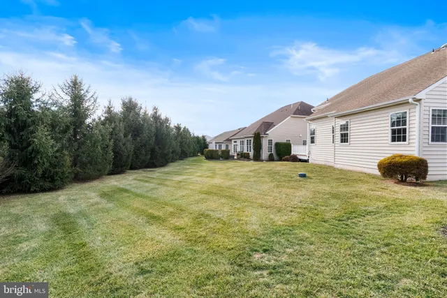 a house with swimming pool in front of it