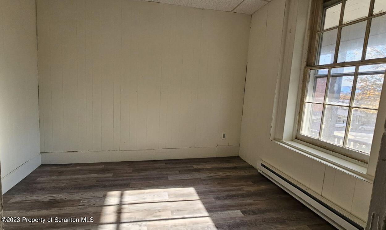 103 Warren Street, Unit 2 Tunkhannock, PA 18657 - Photo 4 of 8 a view of a room with wooden floor and windows