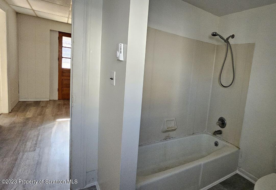103 Warren Street, Unit 2 Tunkhannock, PA 18657 - Photo 8 of 8 a bathroom with a bathtub and shower