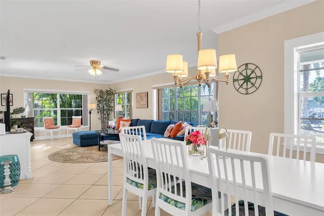 a bedroom with furniture and a large window
