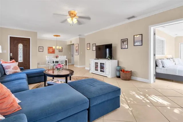 a living room with furniture and a flat screen tv