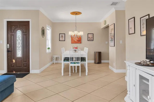 a dining room with furniture and window