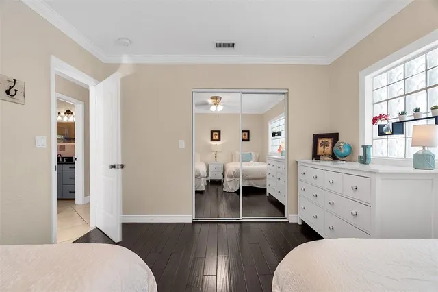 a spacious bathroom with a toilet sink and mirror