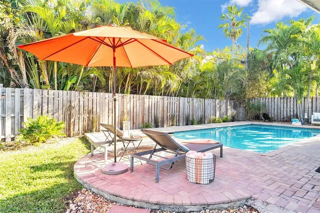a patio with table and chairs