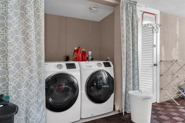 a utility room with dryer and washer