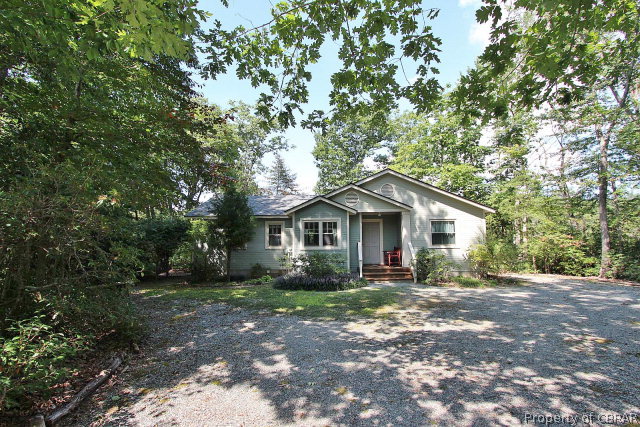 80 Deer Run Road Lancaster, VA 22503 - Photo 5 of 32 a house with a tree in front of it