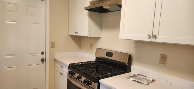 a close view of a sink a faucet and appliance in the kitchen