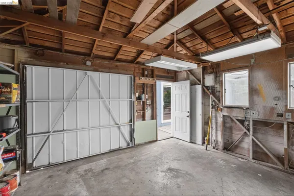 a bedroom with bed and a window