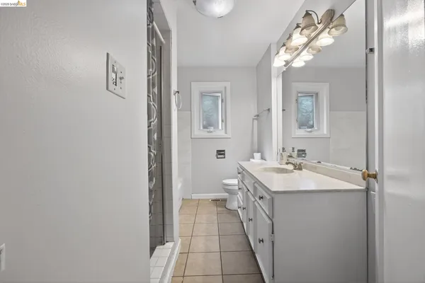 a view of a patio with table and chairs and potted plants