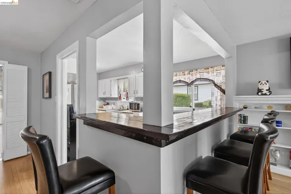 a kitchen with stainless steel appliances a sink stove and refrigerator