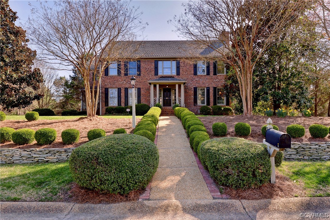 a view of a yard in front of a brick house