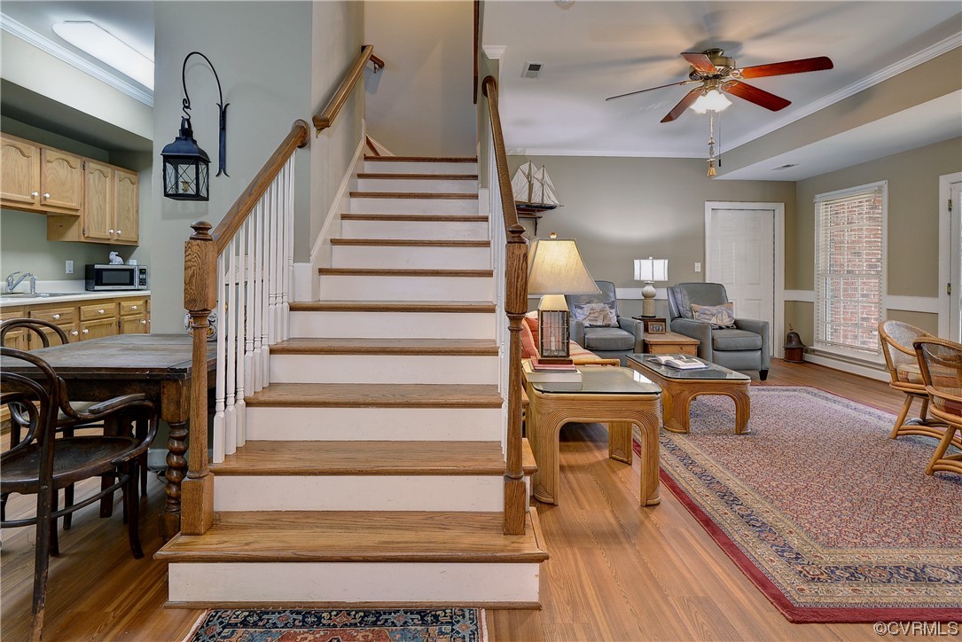 101 Spring Branch Williamsburg, VA 23185 - Photo 28 of 44 a view of a livingroom with furniture a fireplace chandeliers fan