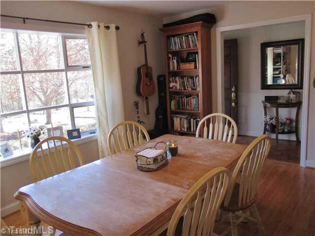 720 Lakedale Road Colfax, NC 27235 - Photo 4 of 14 Dining Room. The living room is holding the dining room