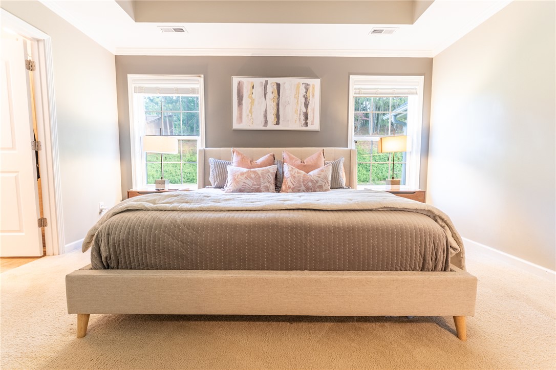 1012 Whirlaway Circle Anderson, SC 29621 - Photo 11 of 25 Recessed lighting illuminates this inviting bedroom, featuring ample natural light through well-placed windows.