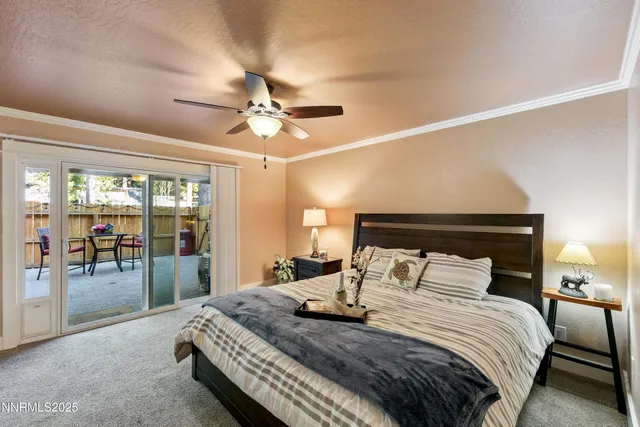 a bedroom with a large bed and a large window