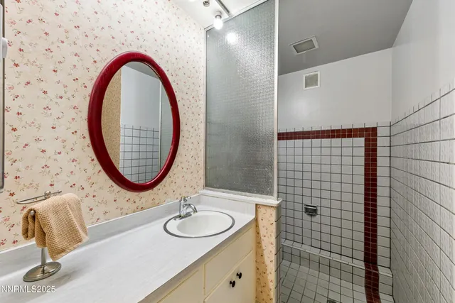 a bathroom with a sink and a mirror