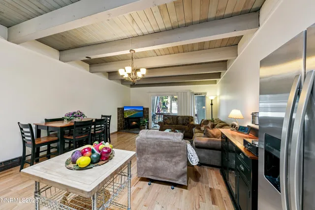 a living room with furniture and a dining table