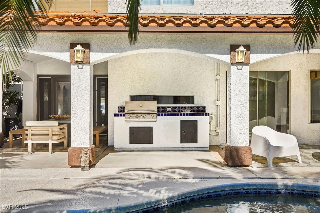 2829 Via Florentine Street Henderson, NV 89074 - Photo 14 of 48 View of patio featuring an outdoor kitchen and an outdoor pool