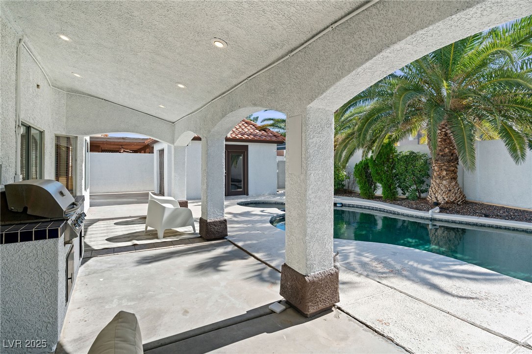 2829 Via Florentine Street Henderson, NV 89074 - Photo 18 of 48 Swimming pool with a patio and area for grilling