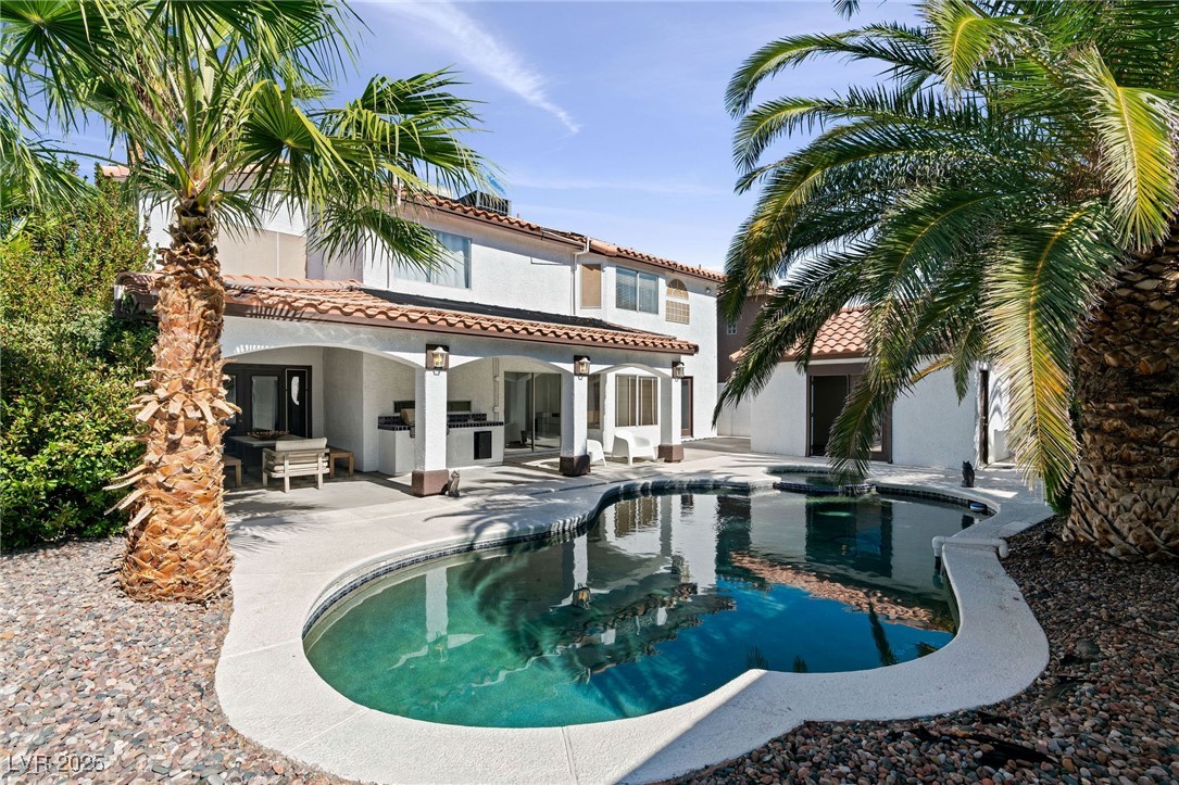 2829 Via Florentine Street Henderson, NV 89074 - Photo 36 of 48 Back of property featuring an outdoor pool, a patio, stucco siding, and a tile roof