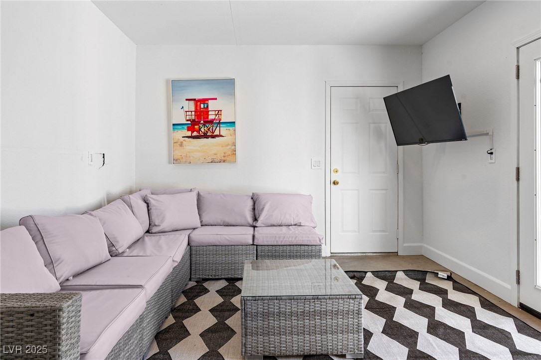 2829 Via Florentine Street Henderson, NV 89074 - Photo 46 of 48 Living room featuring light colored carpet and baseboards