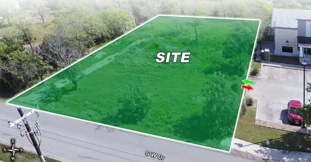 a view of a back yard from a balcony