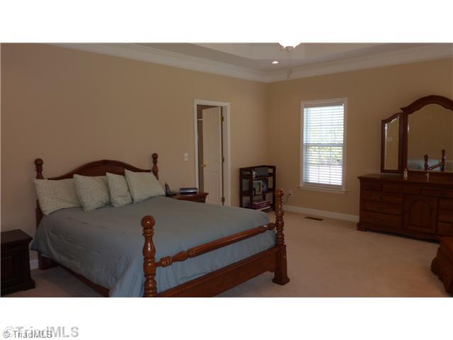 3201 Cross Tree Road Winston-Salem, NC 27106 - Photo 8 of 16 Master Bedroom. Spacious master bedroom has trey ceiling with ceiling fan w/light kit and crown molding.