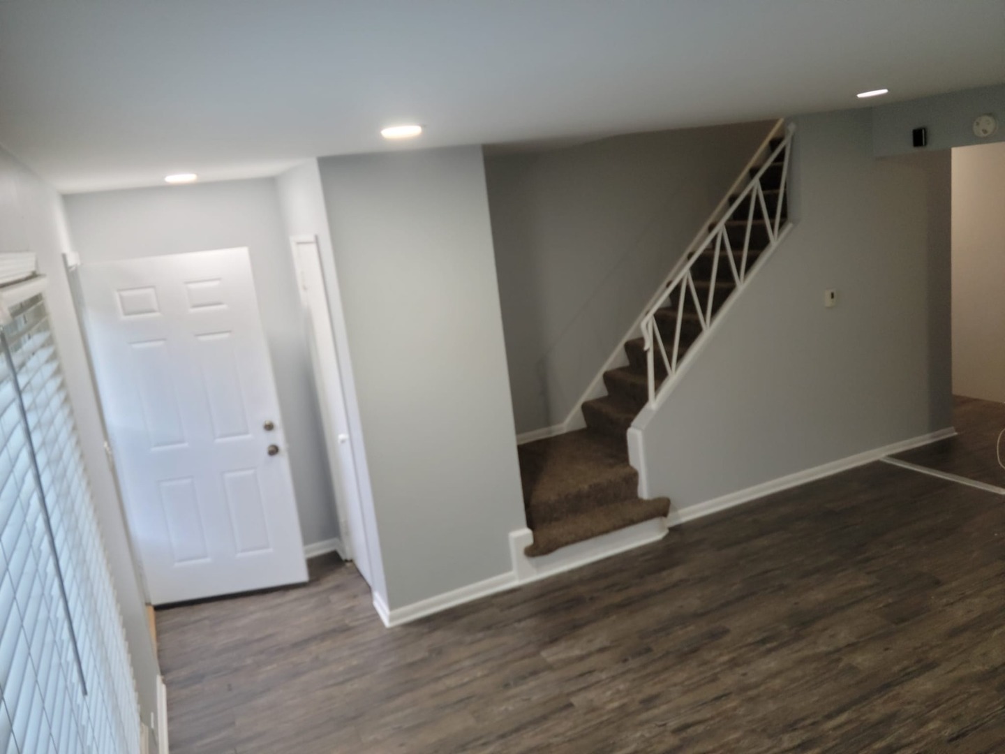 10081 Frontage Road, Unit D Skokie, IL 60077 - Photo 4 of 12 a view of a hallway with wooden floor and stairs