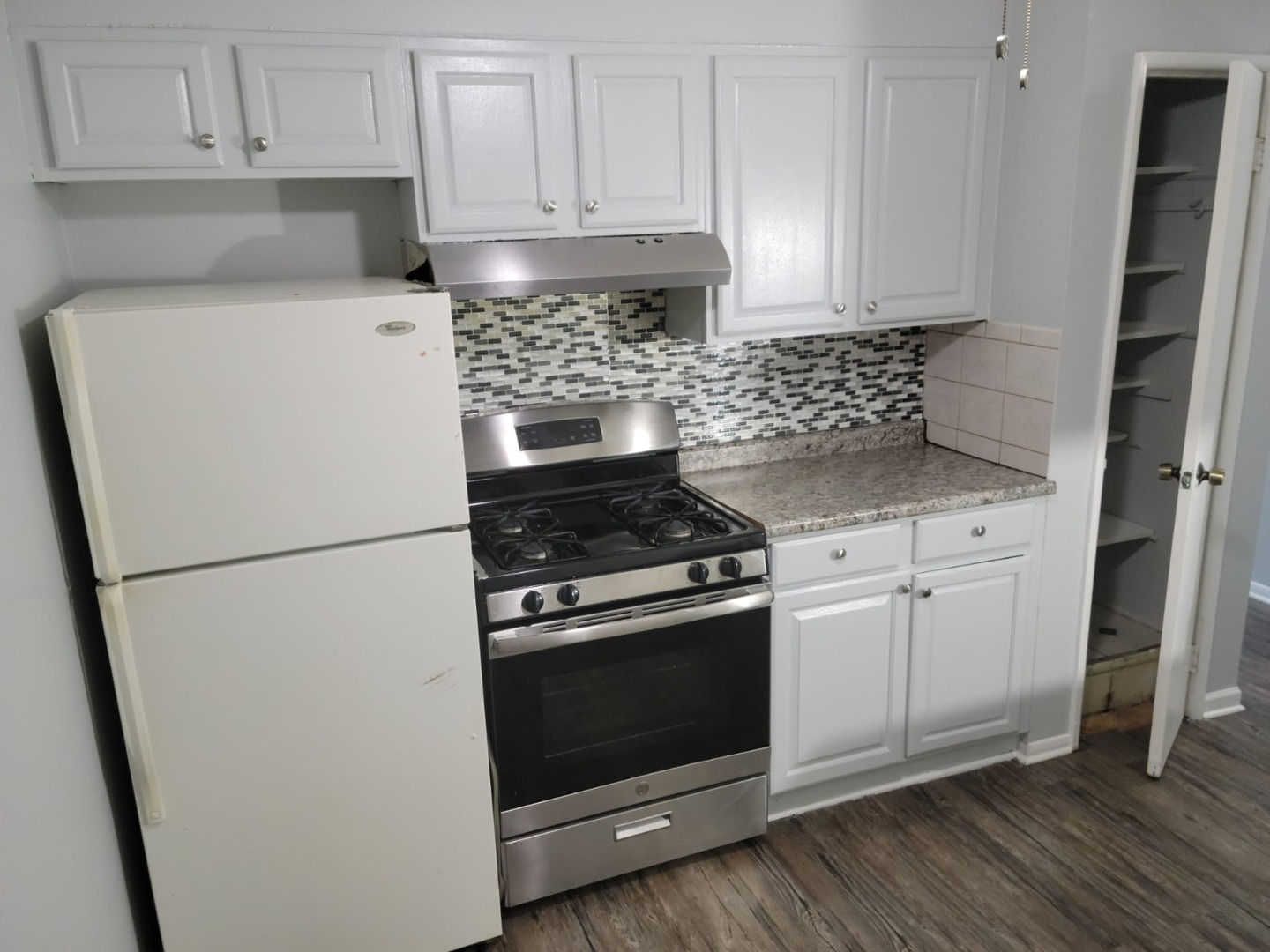 10081 Frontage Road, Unit D Skokie, IL 60077 - Photo 8 of 12 a kitchen with cabinets and steel stainless steel appliances
